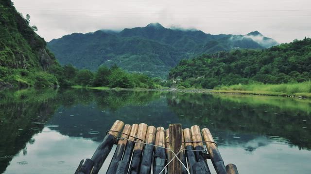 Raft going slowly down a river.