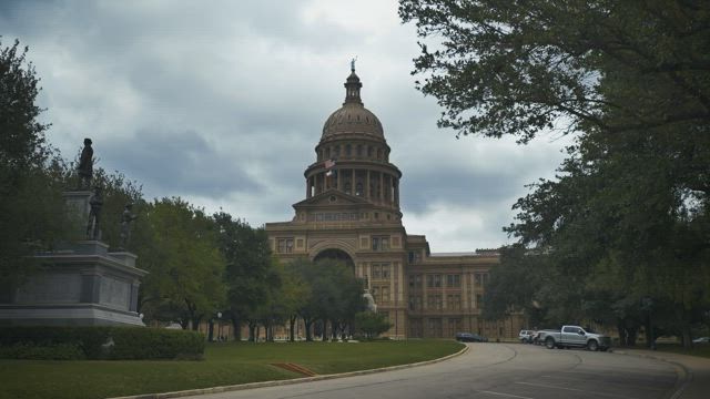 Government Capitol surrounded by a large garden.