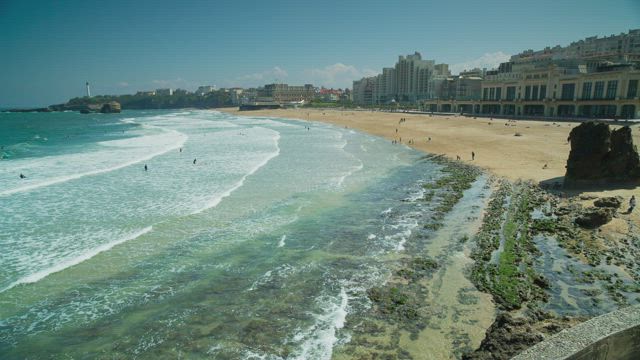 Ocean waves bursting on the shore of the coast.