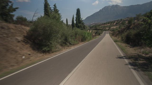 Point of view from a bus passenger seat roading in a highway.