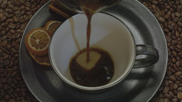 Pouring coffee in a cup.