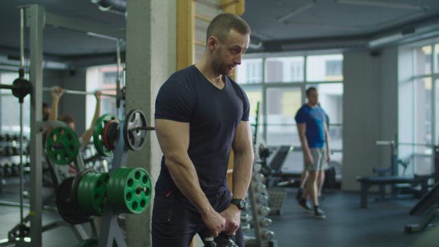 Man exercising with a kettlebell.